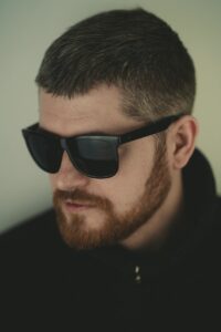 a man with a beard wearing sunglasses